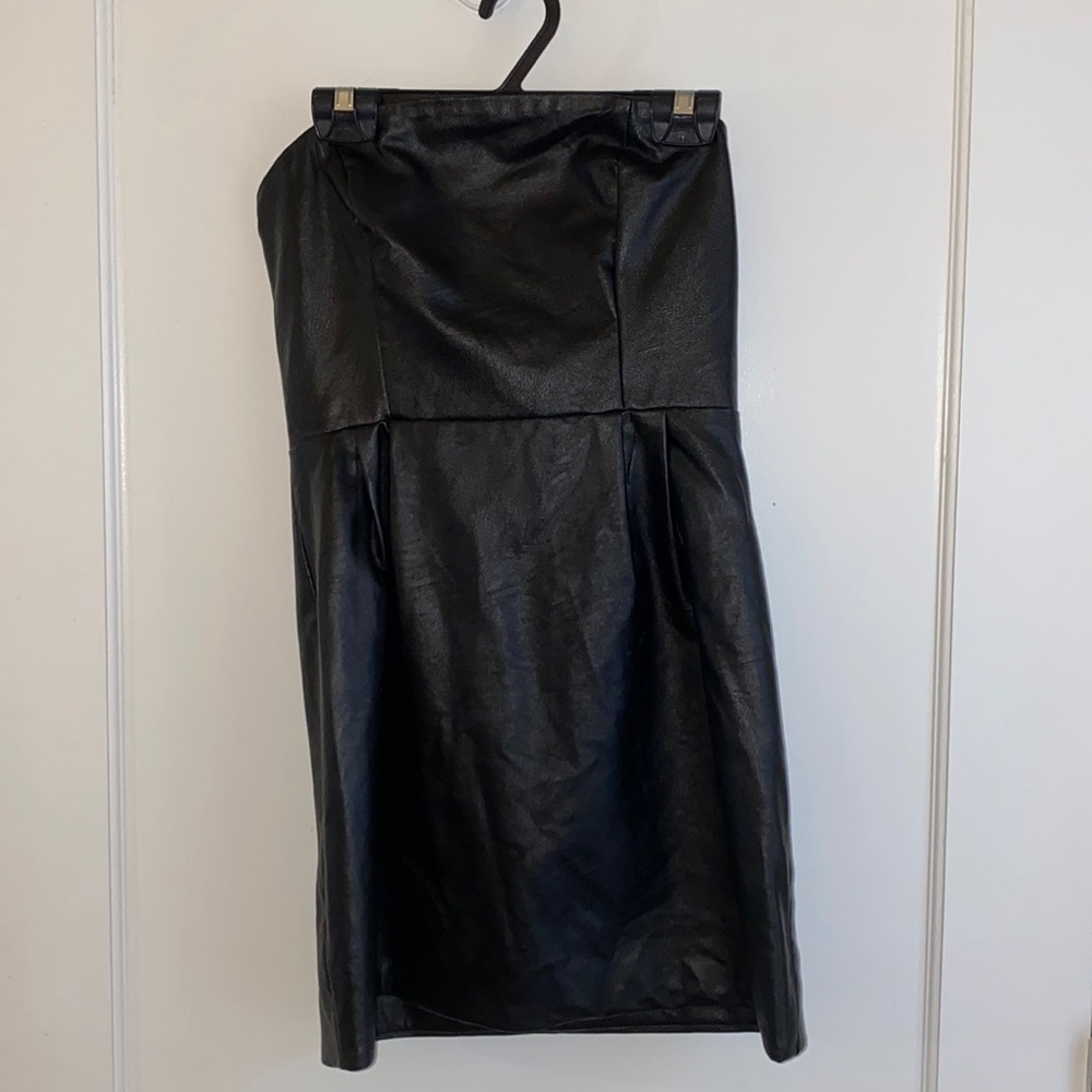 Black strapless leather dress.